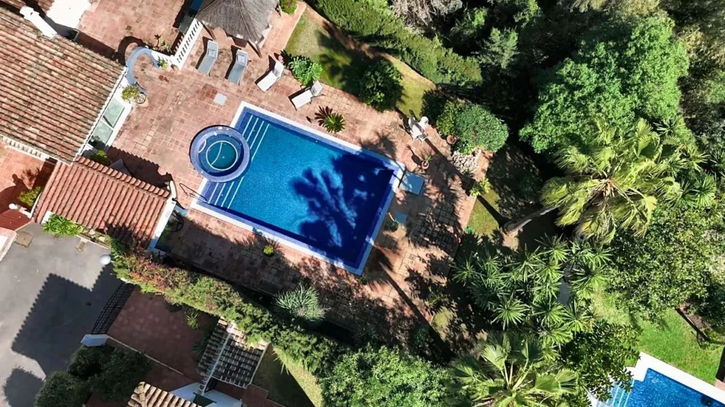 Drone view of a villa pool and garden in Calahonda, Mijas Costa