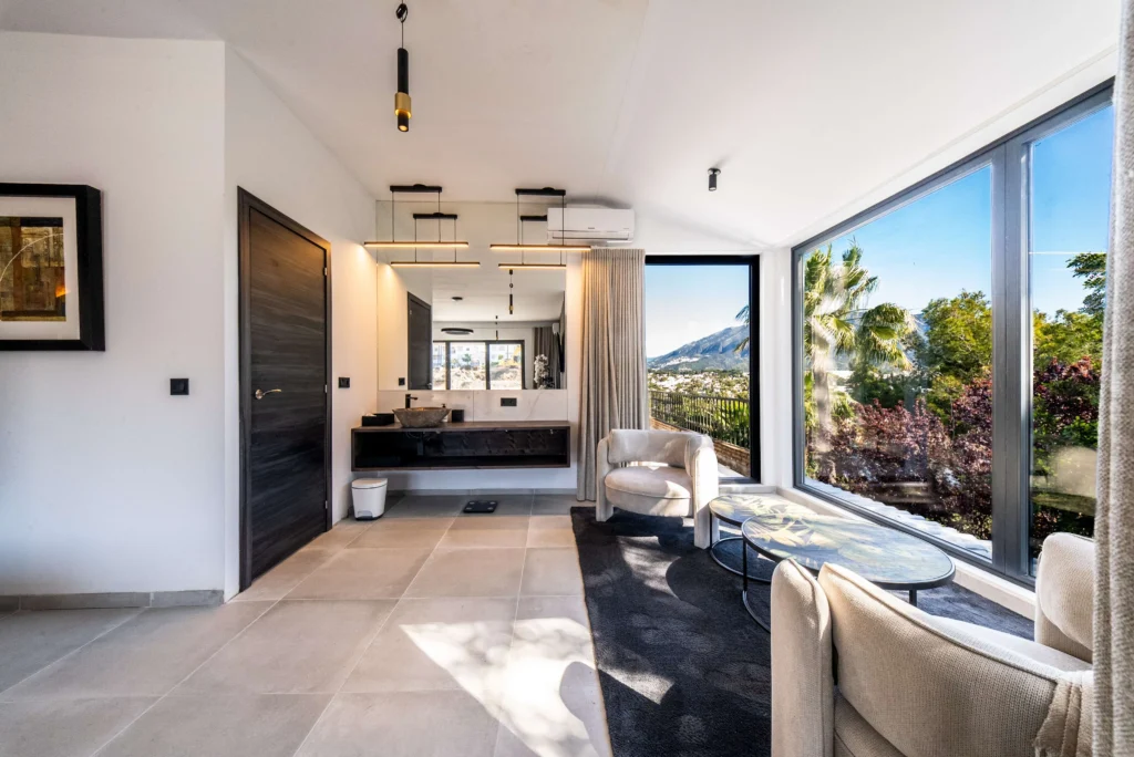 HDR photo of a villa living room with floor-to-ceiling windows