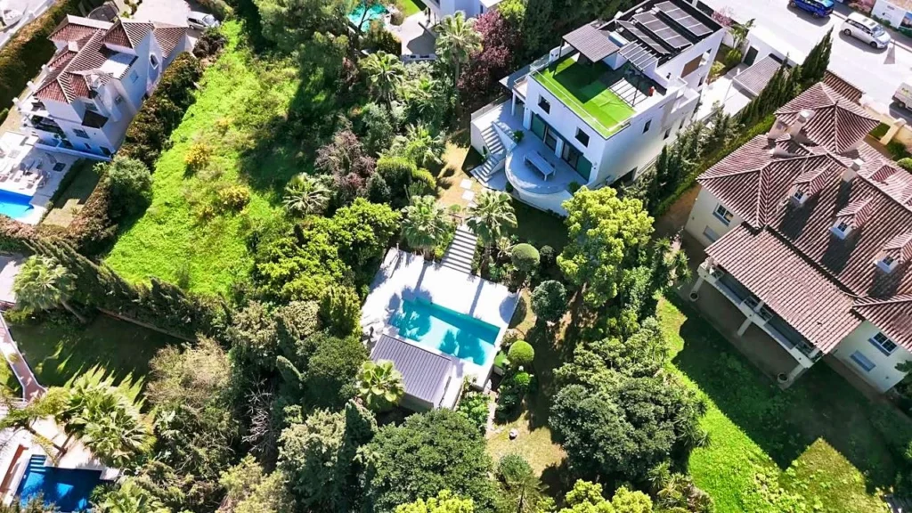Drone view of a modern villa with a pool in Nueva Andalucía, Marbella